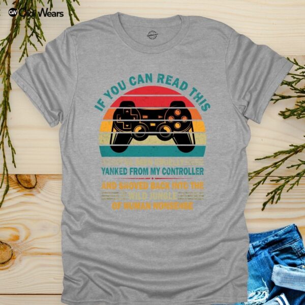 Funny gamer dog lover t-shirt with text 'If You Can Read This, I've Been Yanked from My Controller' in black on a white tee, perfect for gaming and dog enthusiasts